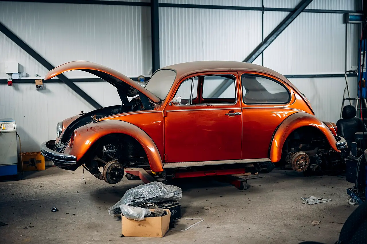 Car raised on a lift in the AUTOMASTER workshop during a major repair